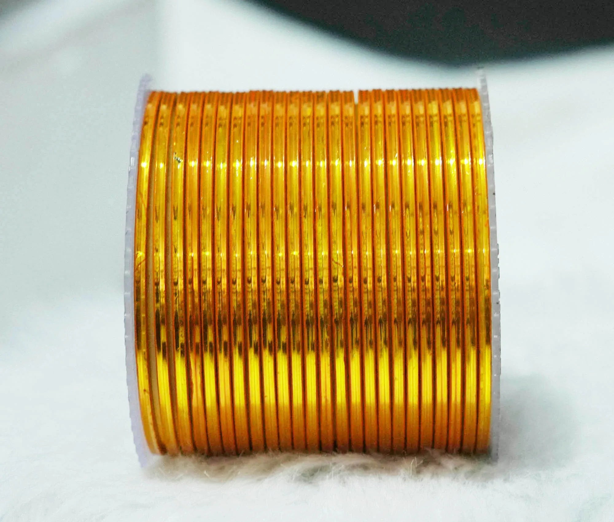 Haldi Color Glossy Metal Bangle for Women & Girls (Pack of 24) - The Golden Cascade